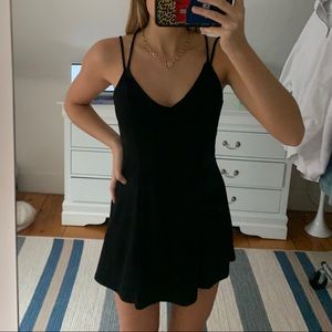Little black dress with open back.